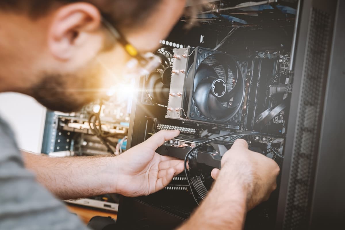 A Sorvo technician working inside a desktop PC